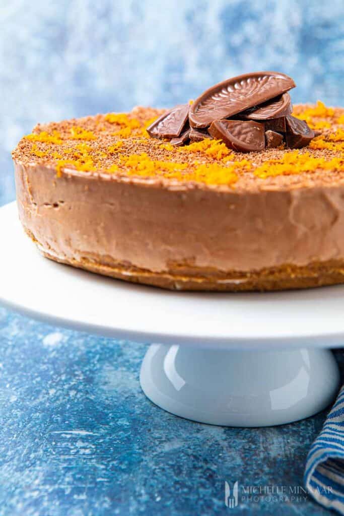 chocolate orange cheesecake on a stand