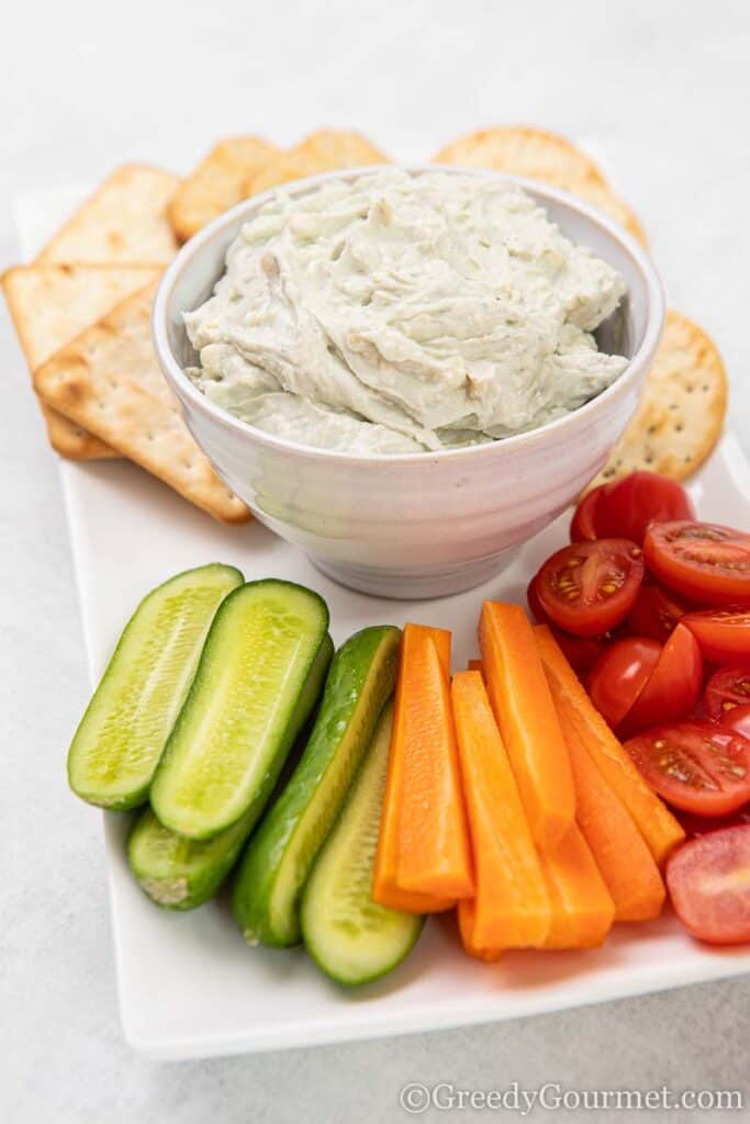 Bowl of blue cheese dip and fresh cut vegetables