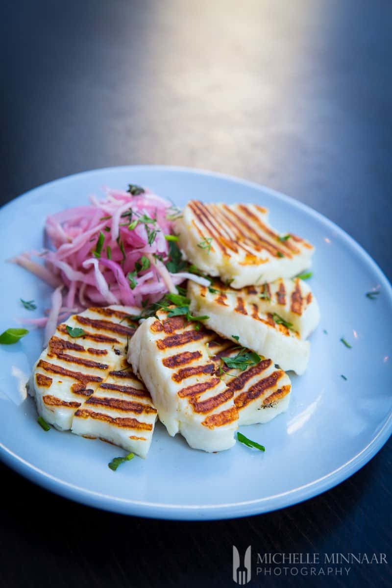 Grilled Halloumi A plate of Grilled Halloumi and coleslaw