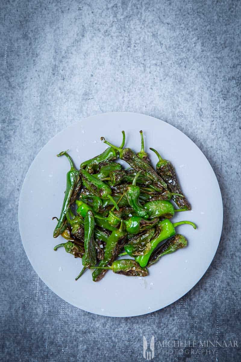 Spanish green peppers A plate of green Pimientos de Padrón